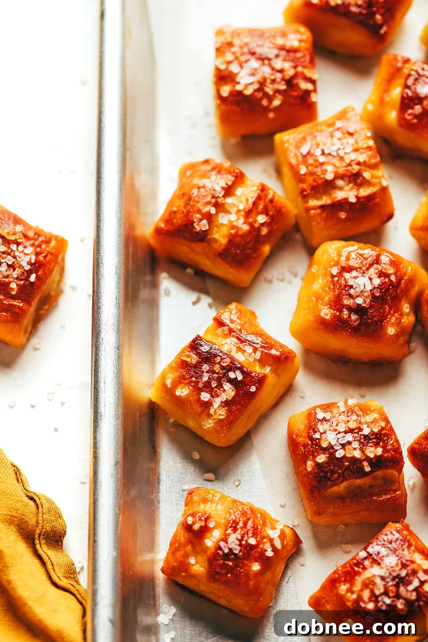 Various customized soft pretzel bites with different toppings.