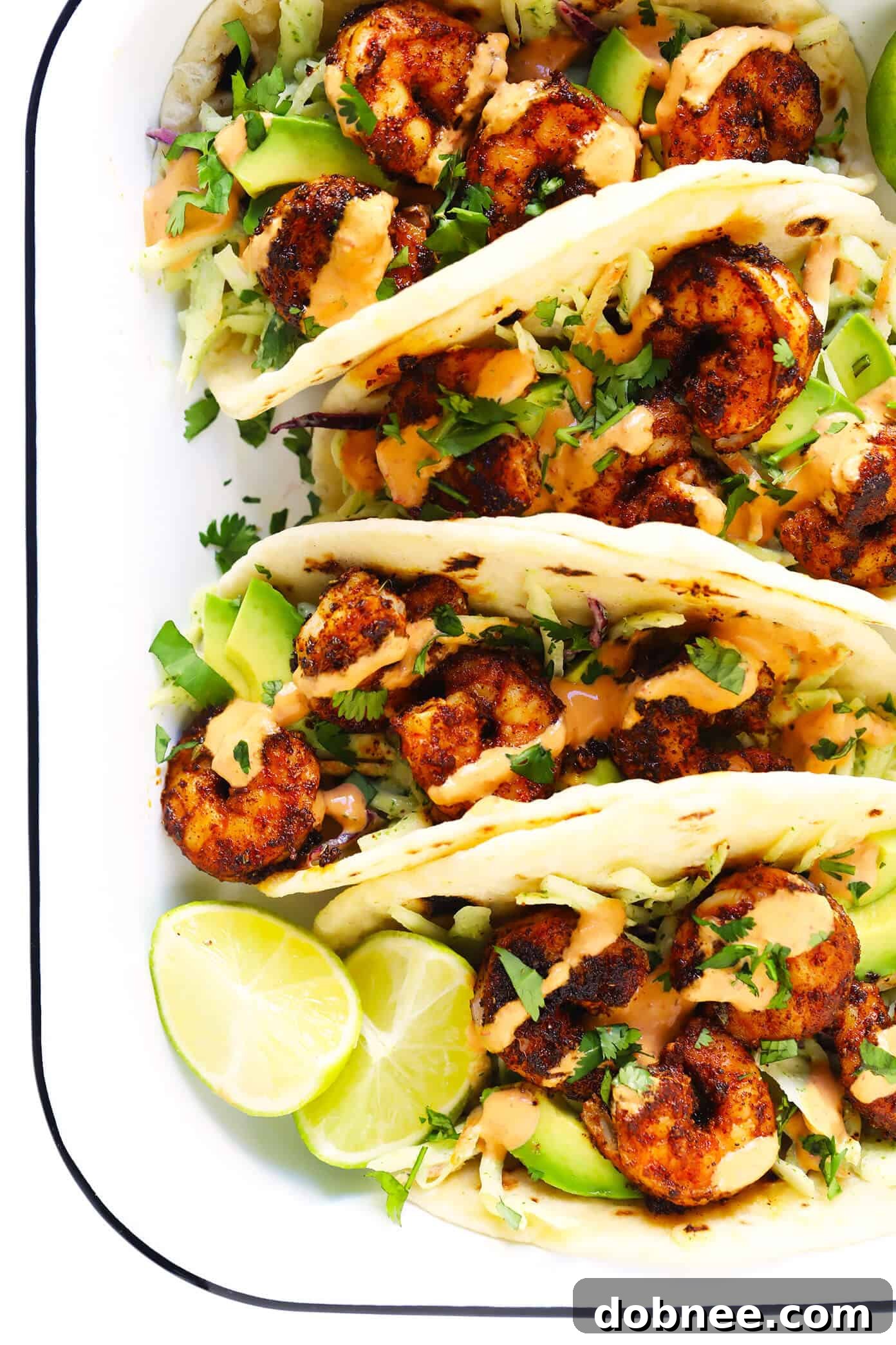 A delicious shrimp taco served on a freshly made homemade flour tortilla.