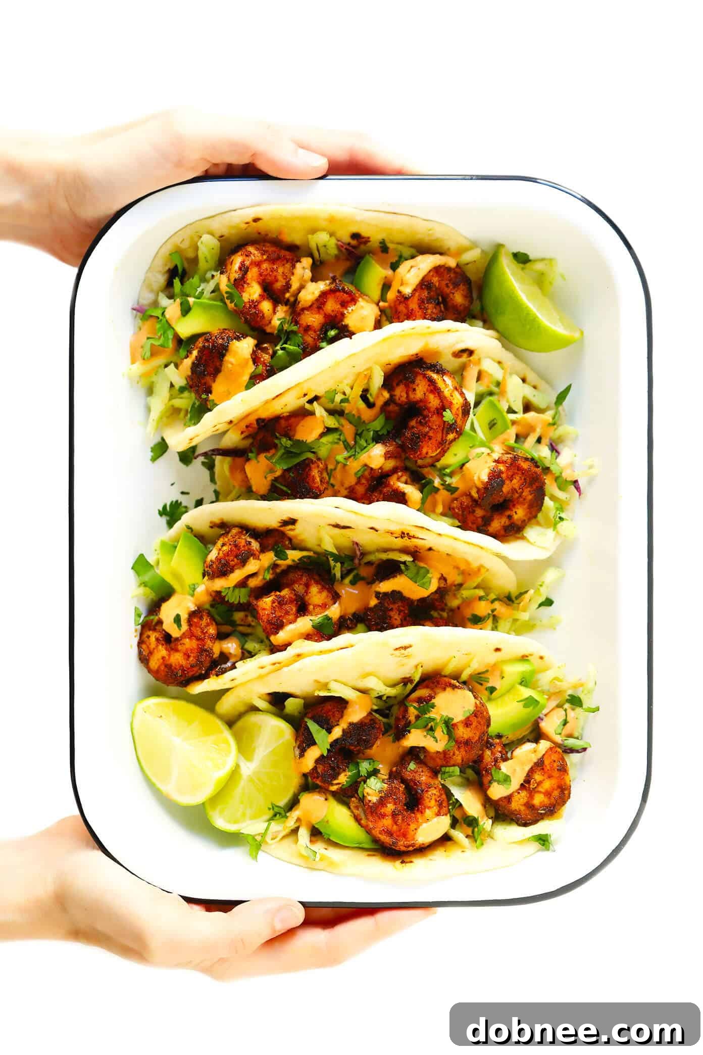 Simple and delicious easy shrimp tacos recipe, perfect for any night of the week. Loaded with flavor! Easy Shrimp Tacos Recipe with Creamy Avocado and Slaw