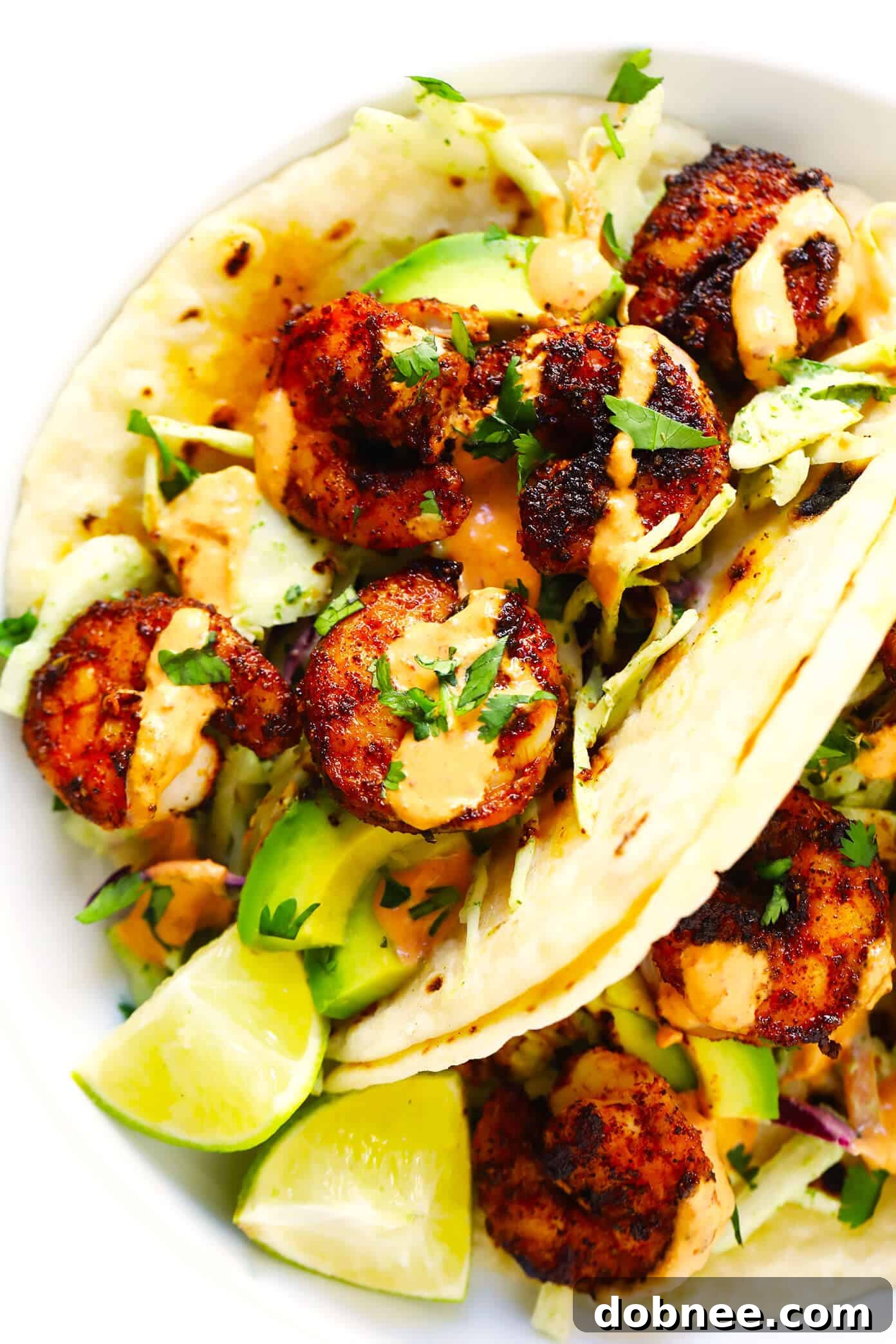 Indulge in the best shrimp tacos, layered with cilantro lime slaw, creamy avocado, and spicy chipotle crema. Best Shrimp Tacos with Cilantro Lime Slaw, Avocado and Chipotle Crema