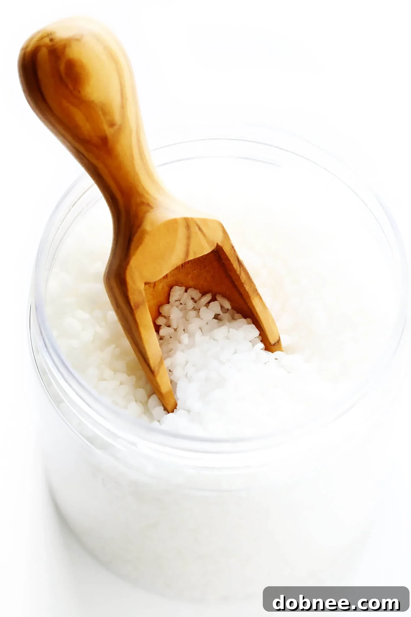 Close-up shot of Swedish Pearl Sugar, chunky and white, used for sprinkling on Kanelbullar to add crunch and decorative finish.