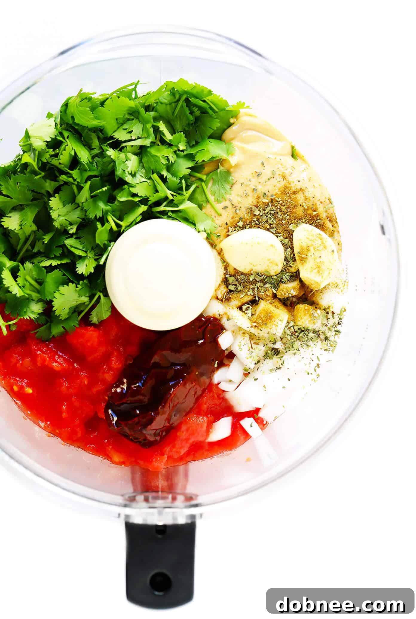 Ingredients to make Peanut Chipotle Salsa in a food processor