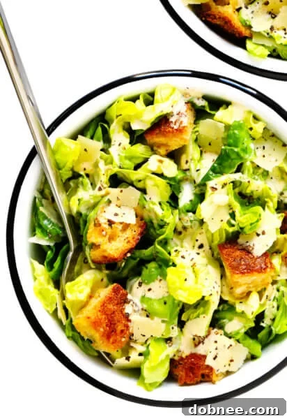 A vibrant Caesar salad with fresh greens and creamy dressing.