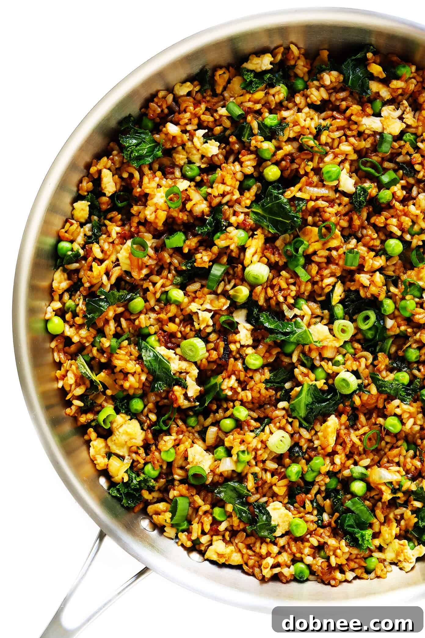 Ginger Kale Fried Brown Rice cooking in a skillet