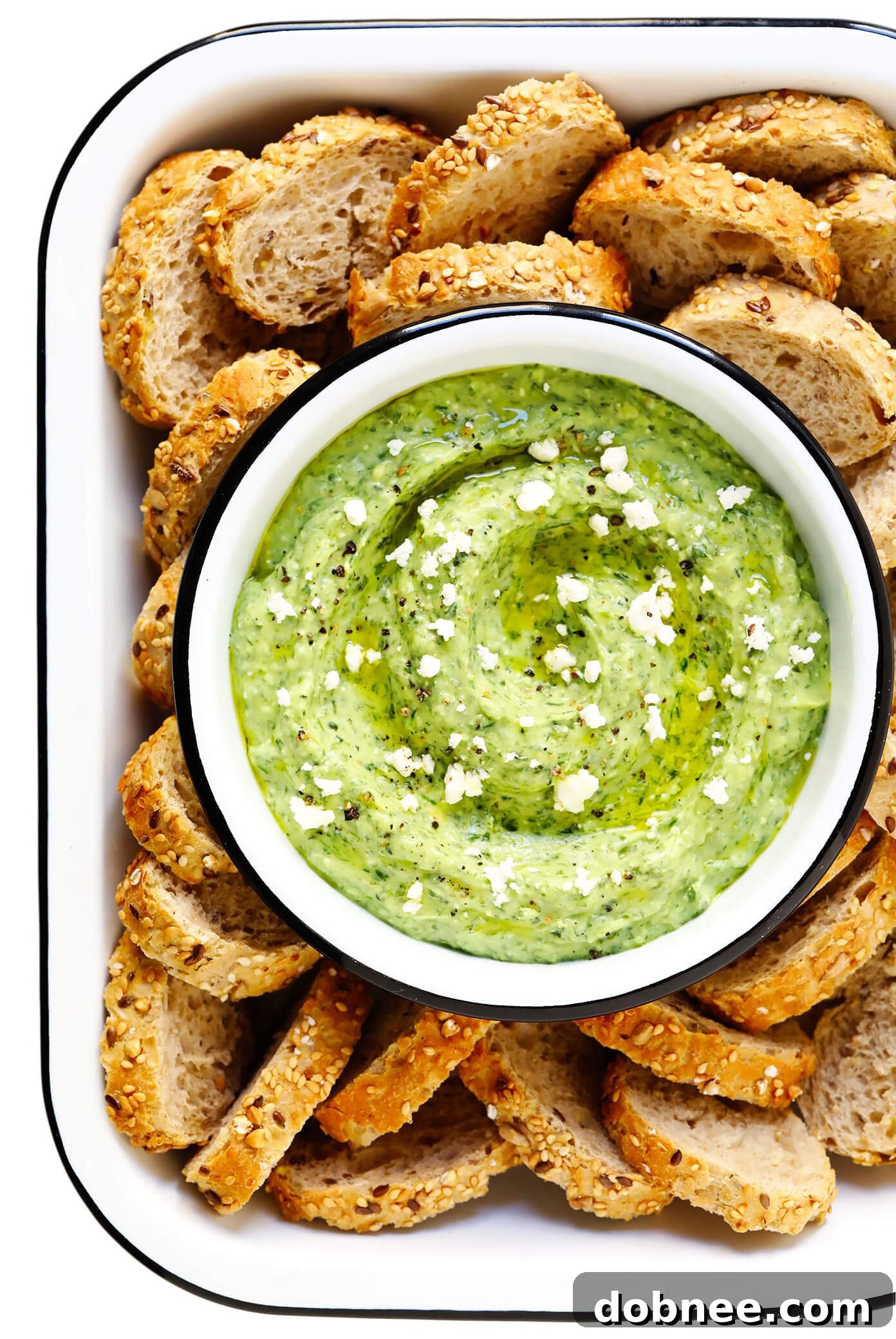 Green Goddess Feta Dip with crusty bread and fresh herbs