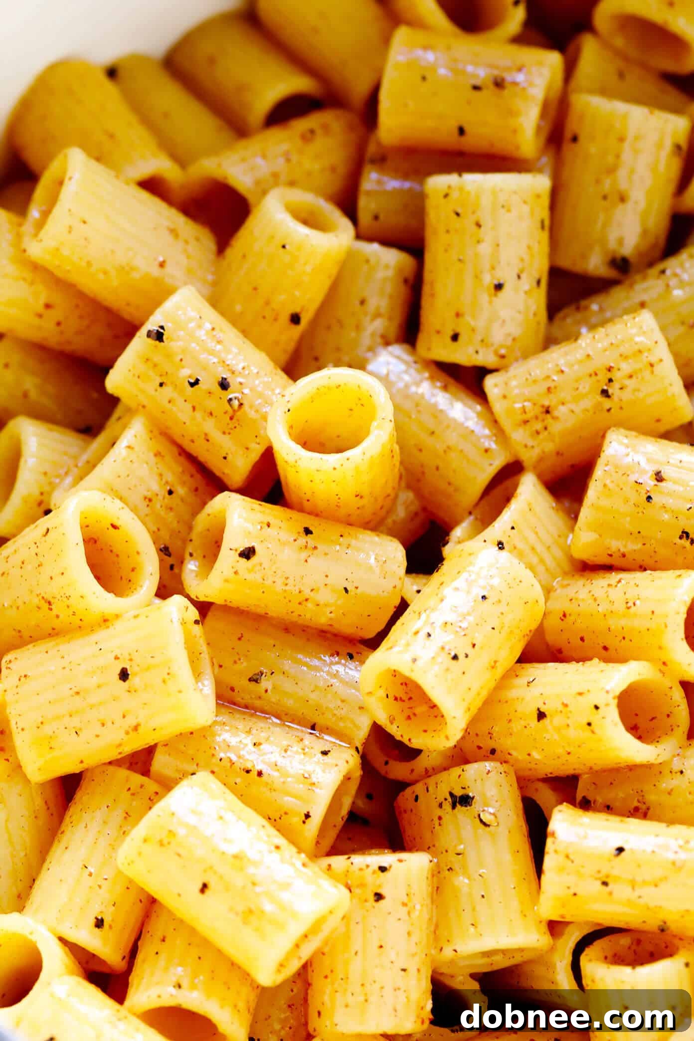 Close-up of Lemon Pepper Pasta, showing the rich, glossy sauce coating the noodles