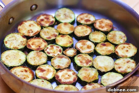 Layers of zucchini, marinara, and mozzarella before baking