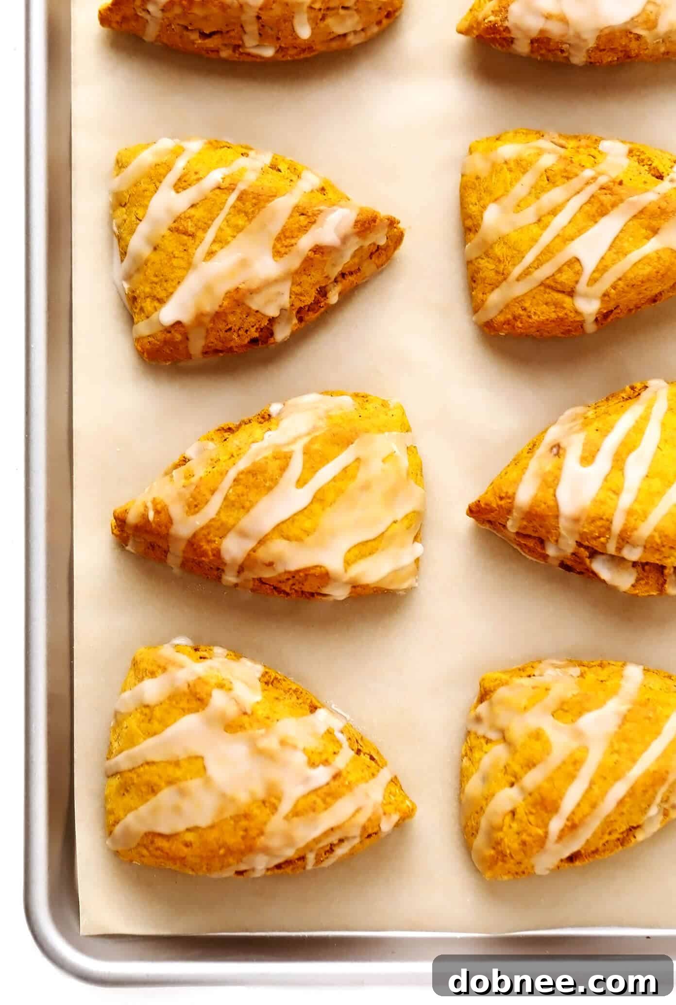 Pumpkin Scones on a parchment-lined baking sheet, ready for baking