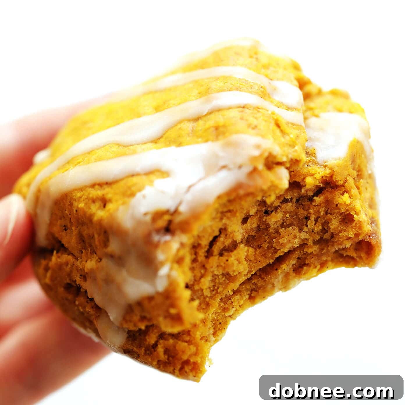 Close-up of a single pumpkin scone showing its texture and glaze