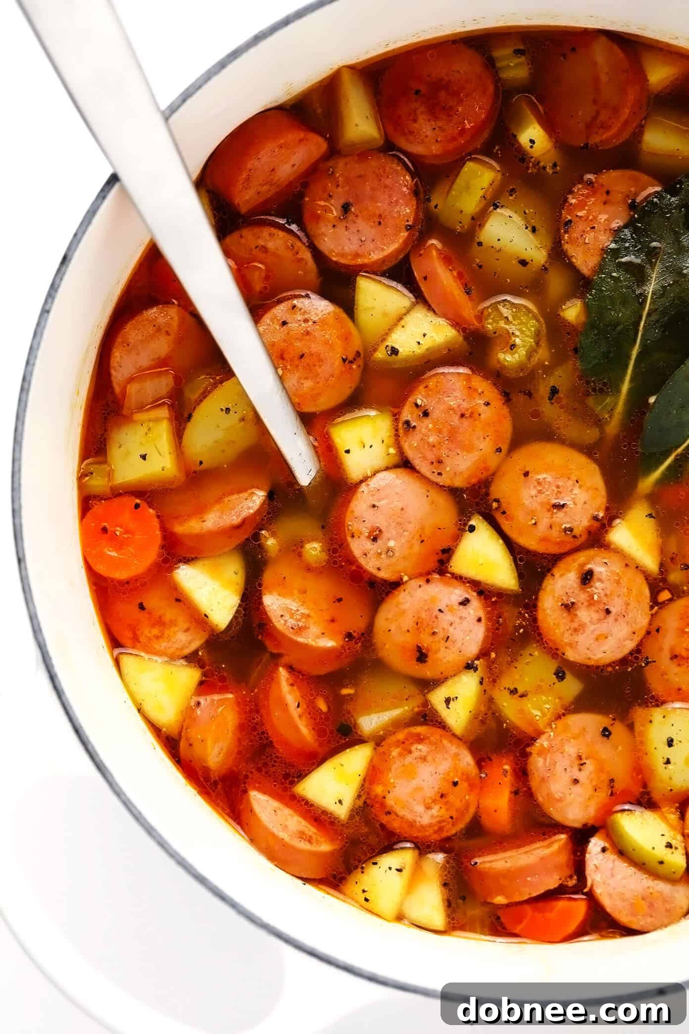 Smoked Sausage, Apple, and Potato Soup without cream, showing rich broth and tender ingredients
