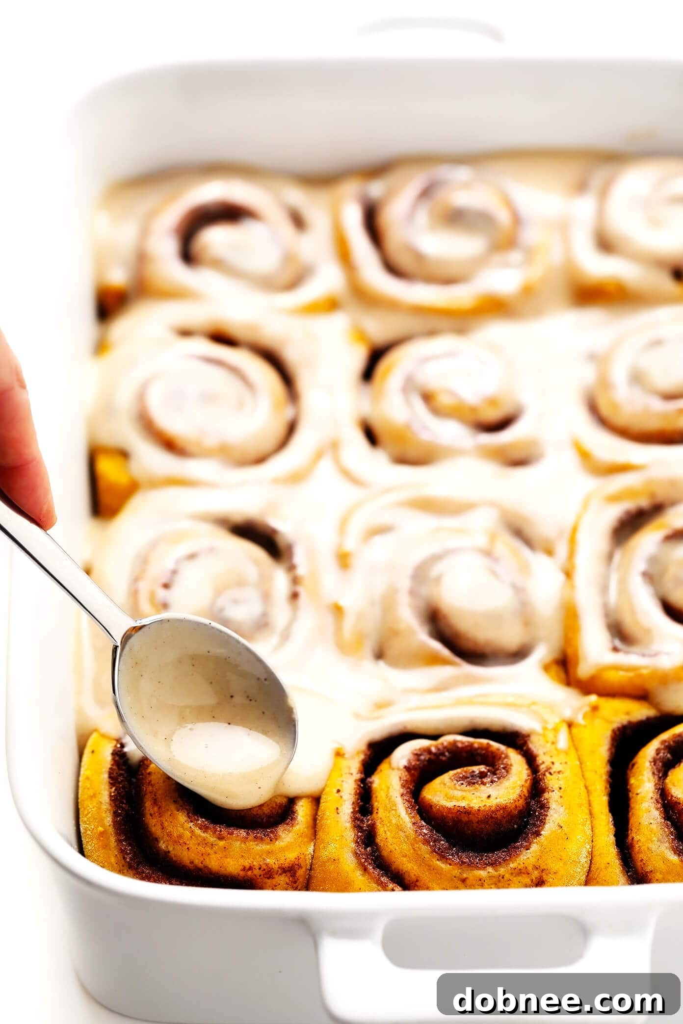 Delicious Pumpkin Cinnamon Rolls with Maple Cream Cheese Frosting Drizzle
