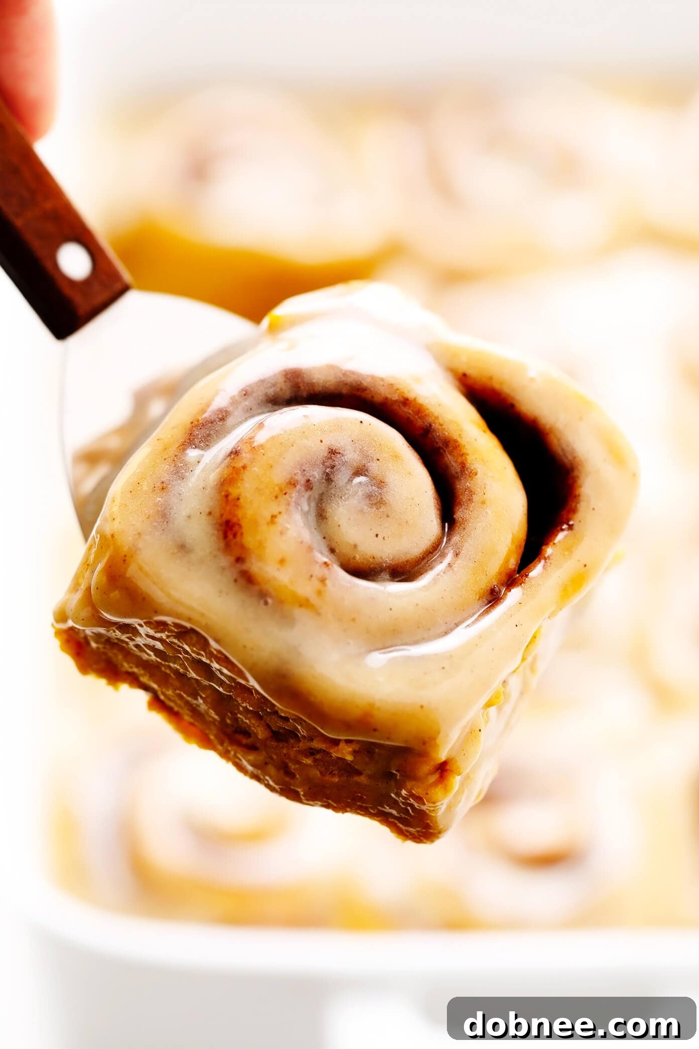 Pumpkin Cinnamon Roll on a Spatula, ready to serve