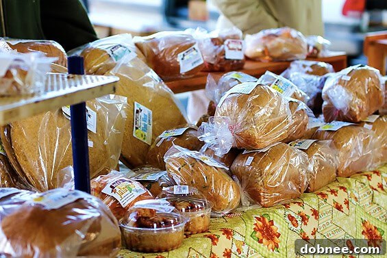 Artisan loaves of freshly baked bread, including various sourdough and rustic varieties