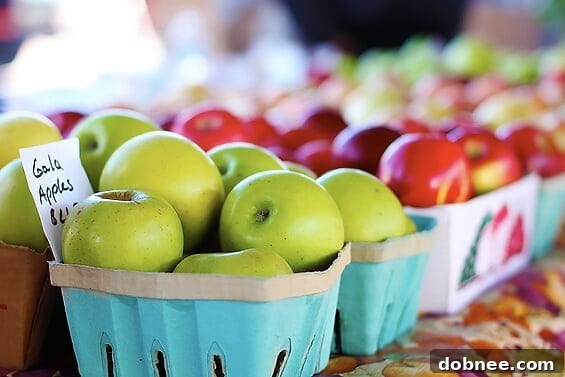 An abundant display of crisp, red apples, freshly picked and ready for purchase