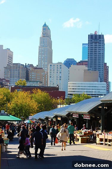 Urban Serenity: Kansas City Skyline from the Market's Edge Kansas City skyline viewed from the perimeter of the City Market, highlighting urban charm and open-air market experience.