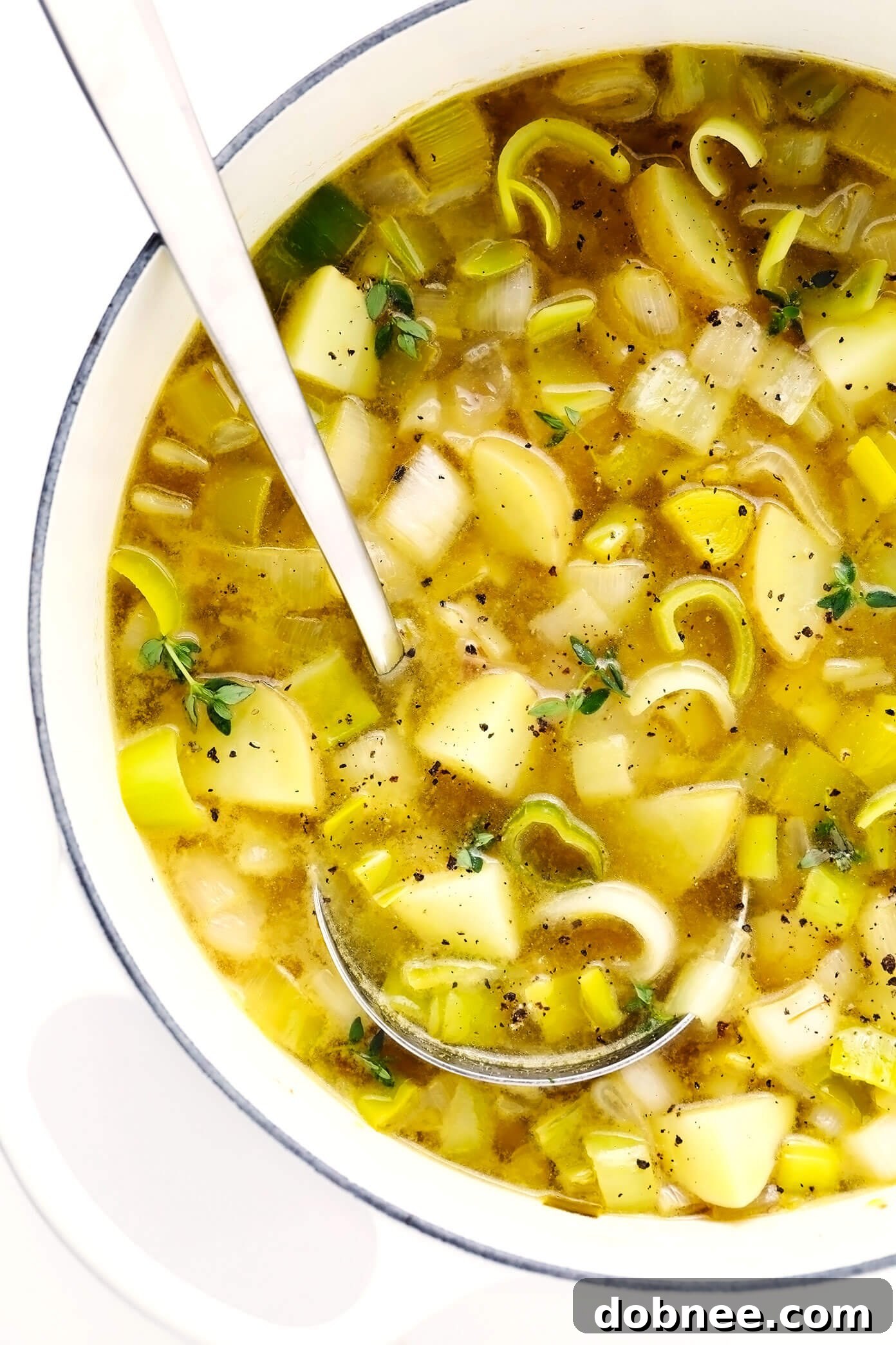 Rustic Potato Leek Soup simmering in a large stockpot