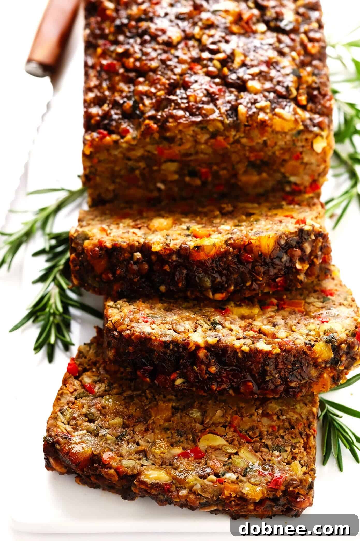 This Nut Roast recipe is packed with a deliciously sweet and savory blend of nuts, veggies, lentils, dried apricots and fresh rosemary and sage. It's easy to prep in advance, naturally gluten-free + vegetarian + vegan, and absolutely delicious served with cranberry sauce and/or gravy. Perfect for the holidays (especially Christmas, Thanksgiving or Easter) or Sunday dinner! | gimmesomeoven.com #nutroast #vegetarian #vegan #glutenfree #healthy #dinner #christmas #holiday Deliciously Sweet and Savory Nut Roast for Holidays and Sunday Dinner