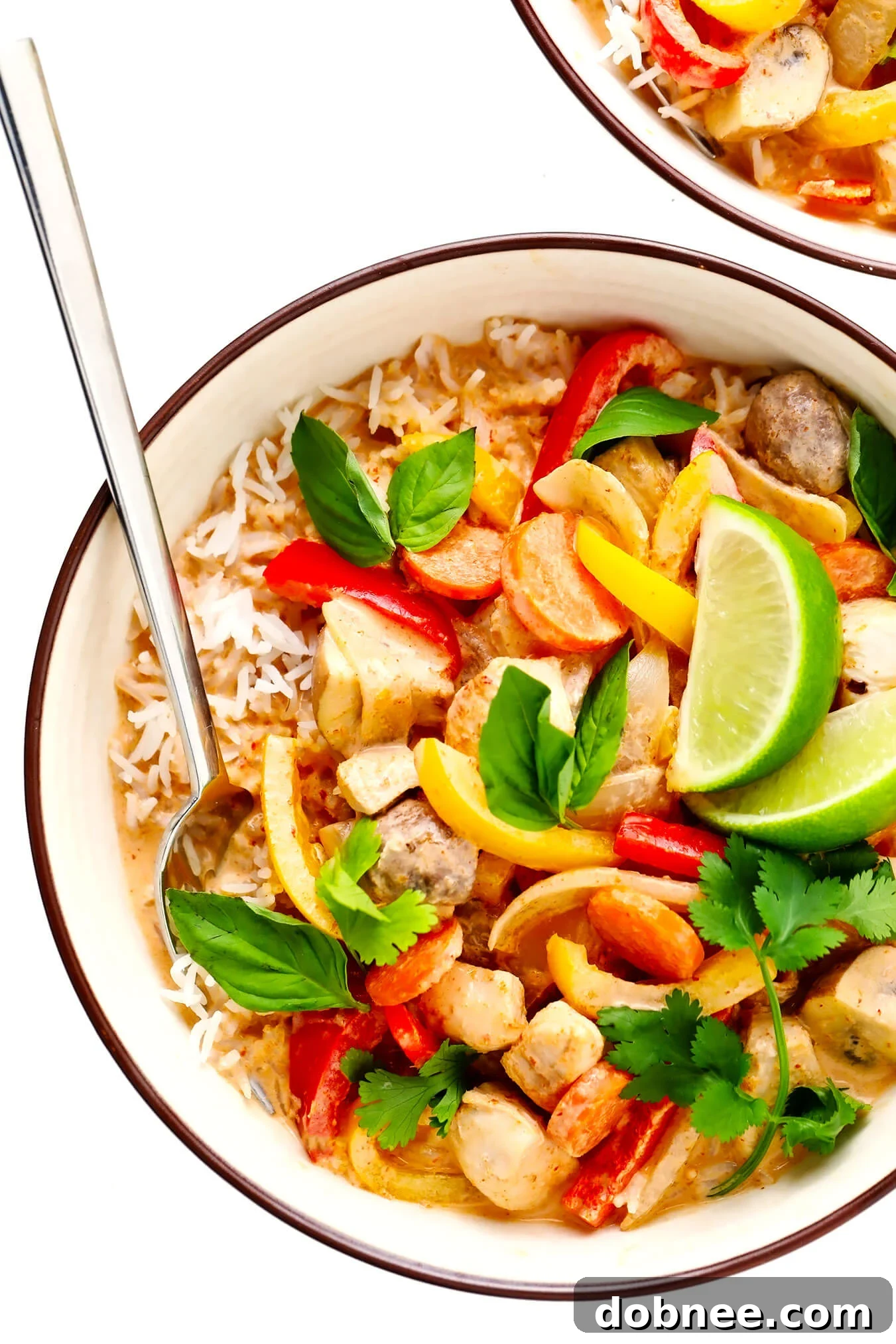 Delicious Thai Chicken Curry served in a bowl, garnished with fresh herbs.