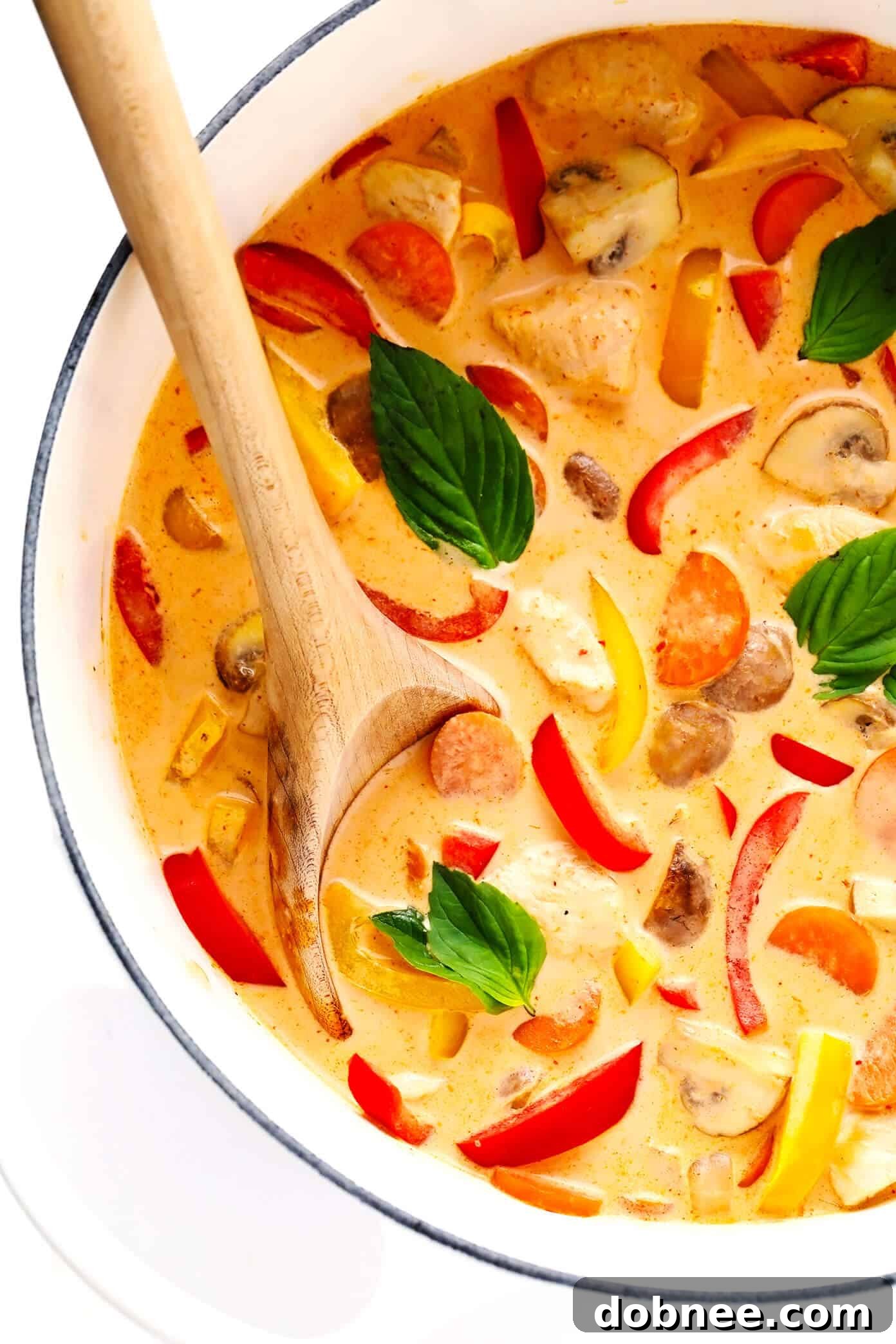 Rich and creamy Thai Red Curry with Chicken simmering in a stockpot, ready to be served.