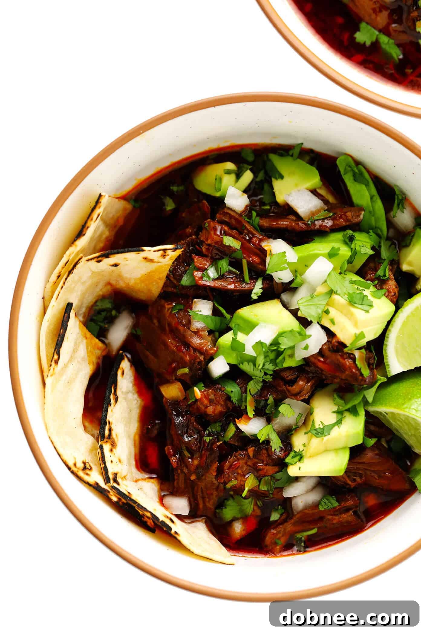 Birria Beef Stew Served in Cozy Bowls with Fresh Toppings