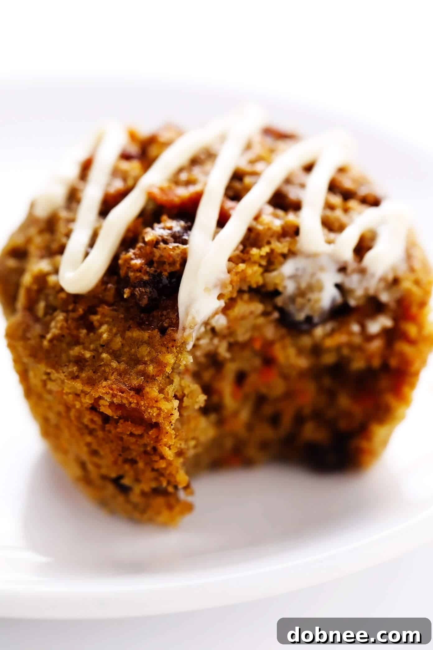 Healthy Carrot Cake Muffin with Bite Taken Out