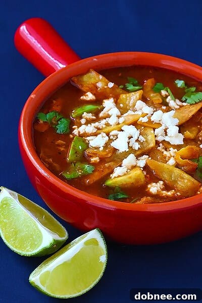 Chicken Tortilla Soup topped with fresh garnishes