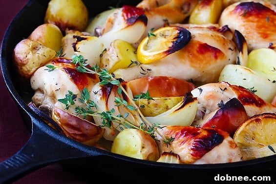 Apple Cider Baked Chicken served in a roasting pan