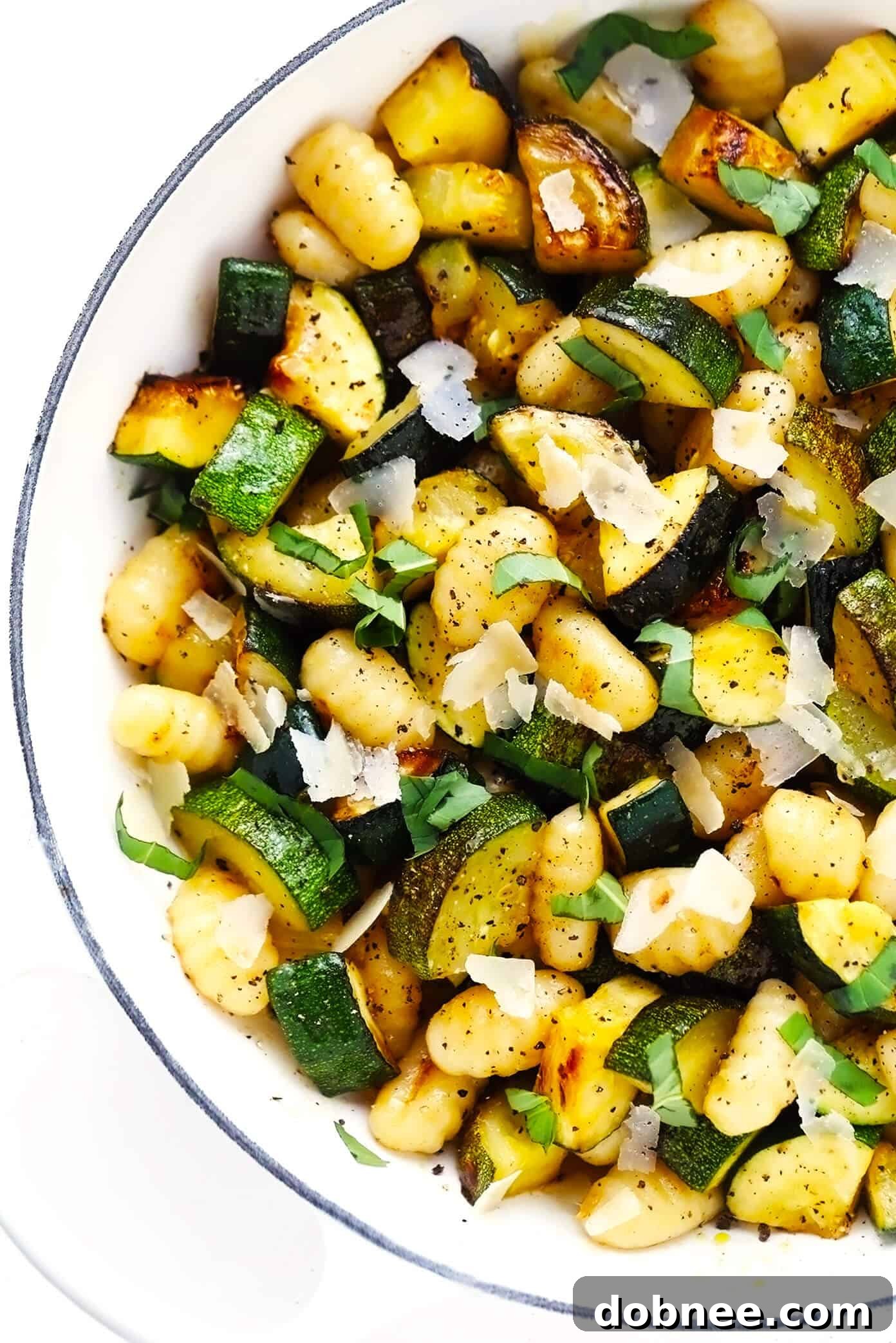 Lemon Basil Gnocchi with Zucchini cooking in a large sauté pan
