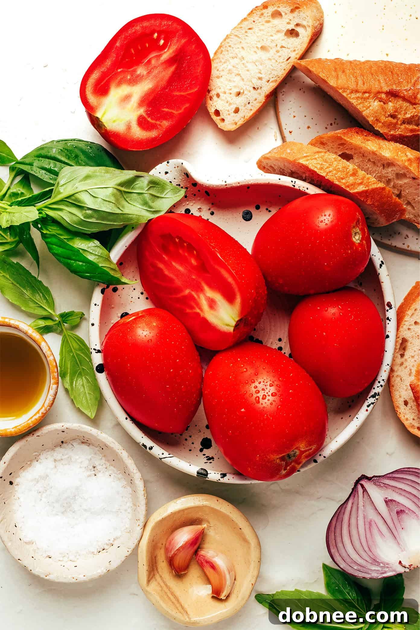 Close-up of bruschetta ingredients: fresh tomatoes, basil, olive oil, garlic, and bread