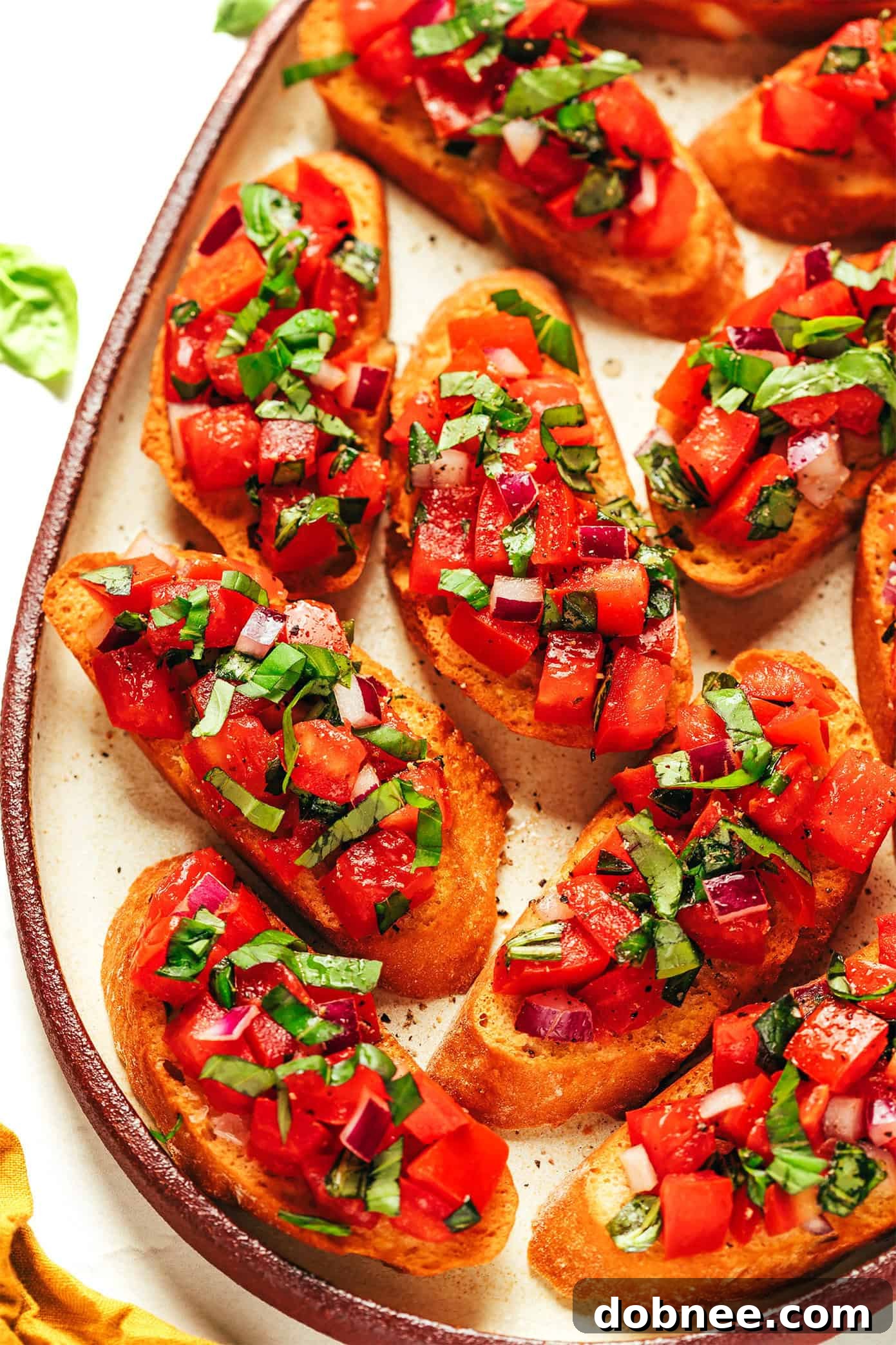 Platter of varied bruschetta, including a classic tomato basil and other creative toppings
