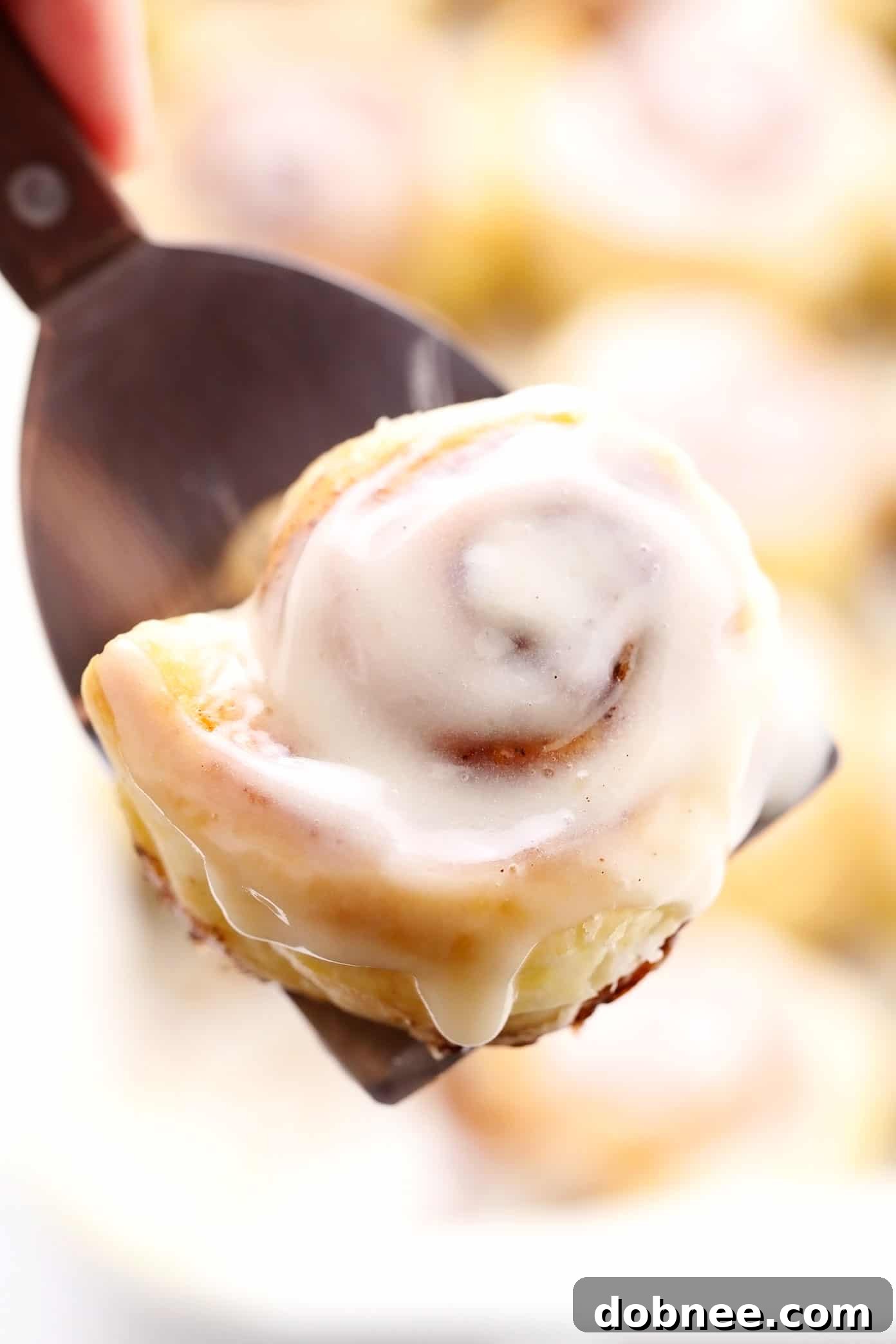 Holding a Warm Puff Pastry Cinnamon Bun