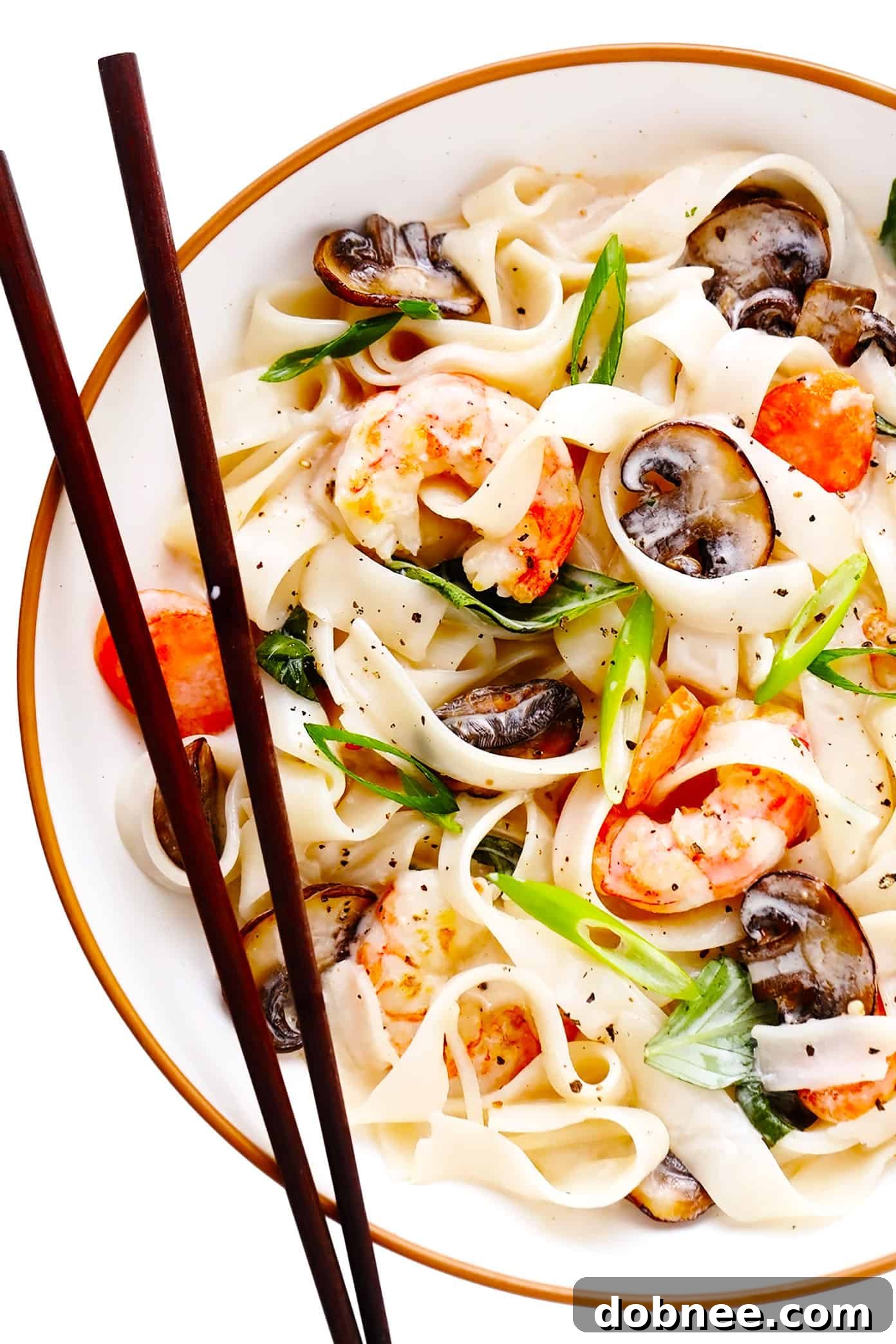 Bowl of Lemongrass Coconut Rice Noodles with Shrimp and Chopsticks