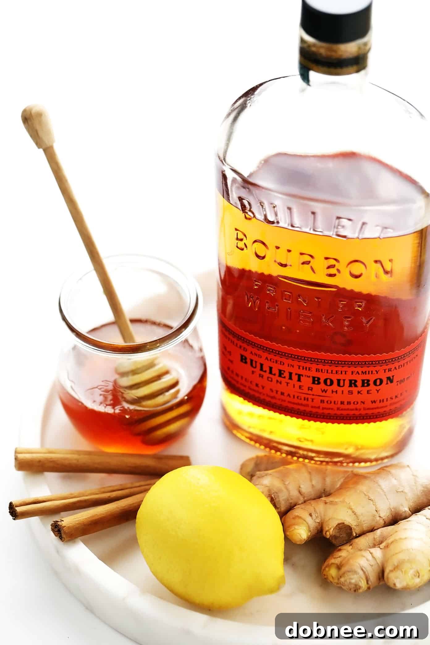 Hot Toddy Ingredients: Whiskey, Honey, Lemon, Cinnamon, and Fresh Ginger