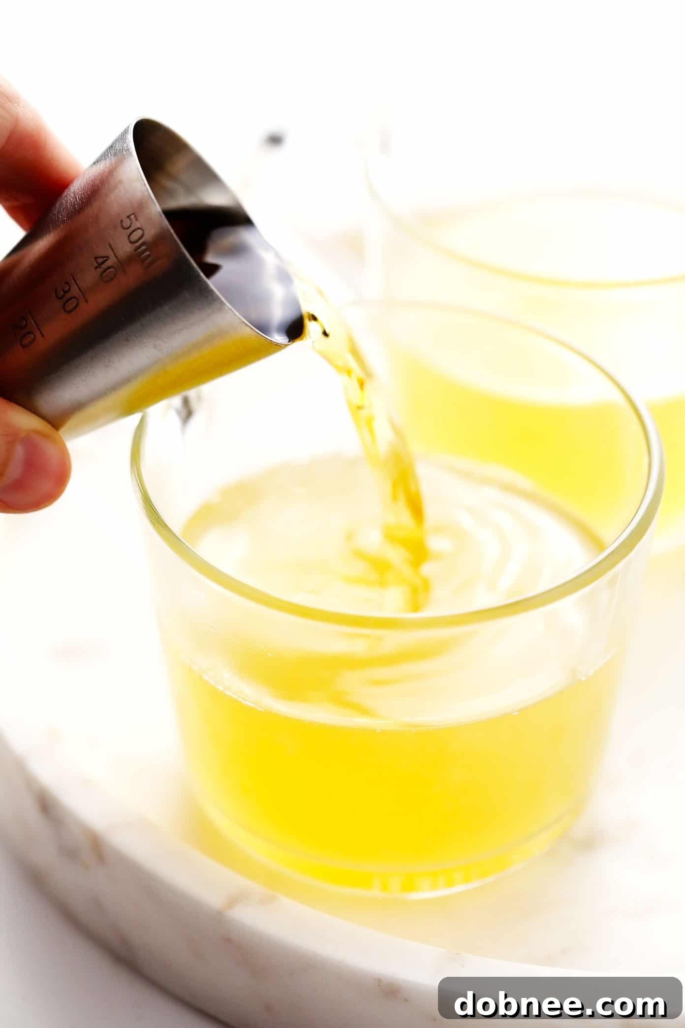 Demonstrating the steps to prepare a Hot Toddy