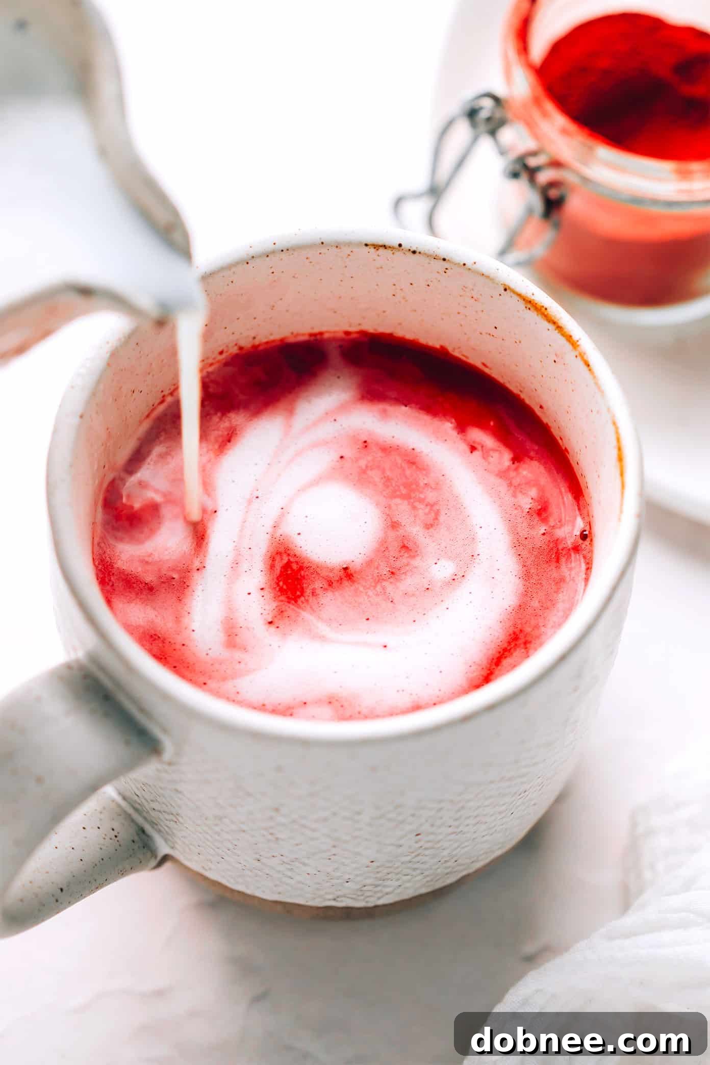 Nutrient-Rich Hot Pink Beetroot Latte, garnished with spices.