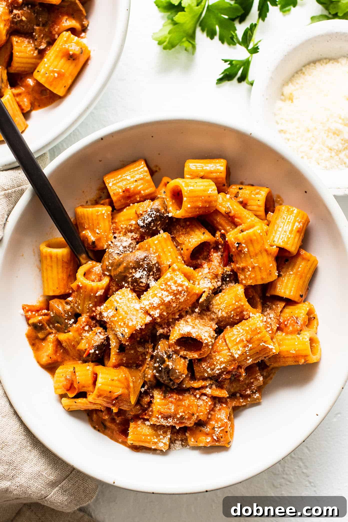 Rich Pasta alla Boscaiola with Mushrooms and Bacon in a Creamy Tomato Sauce