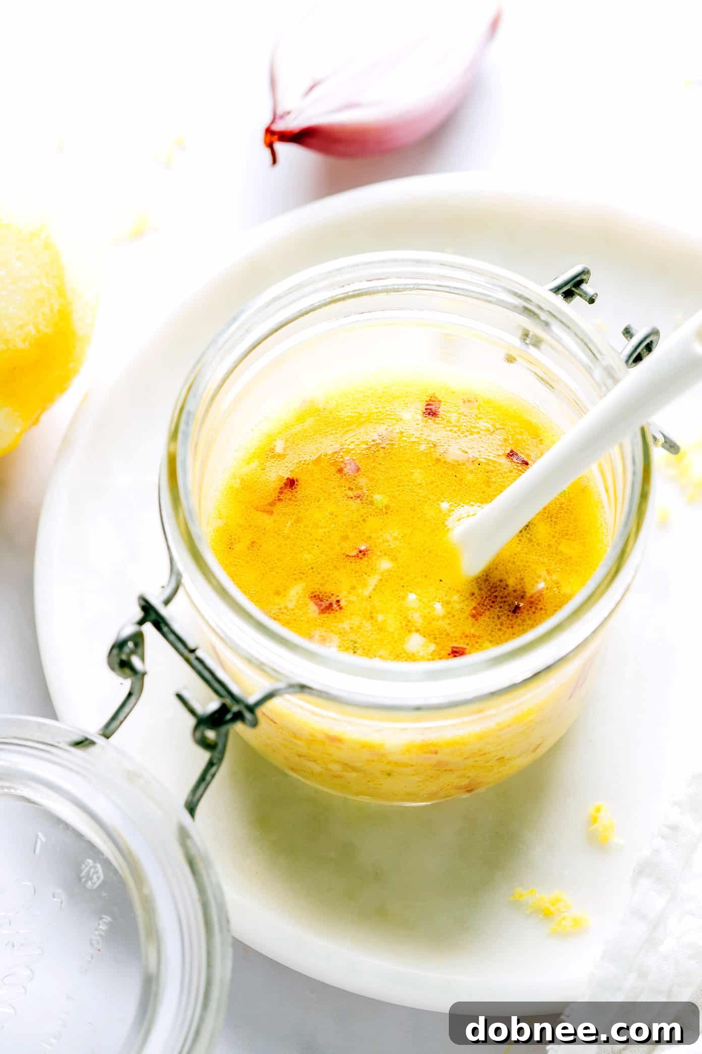 Freshly made Shallot Vinaigrette in a glass jar, ready to be served