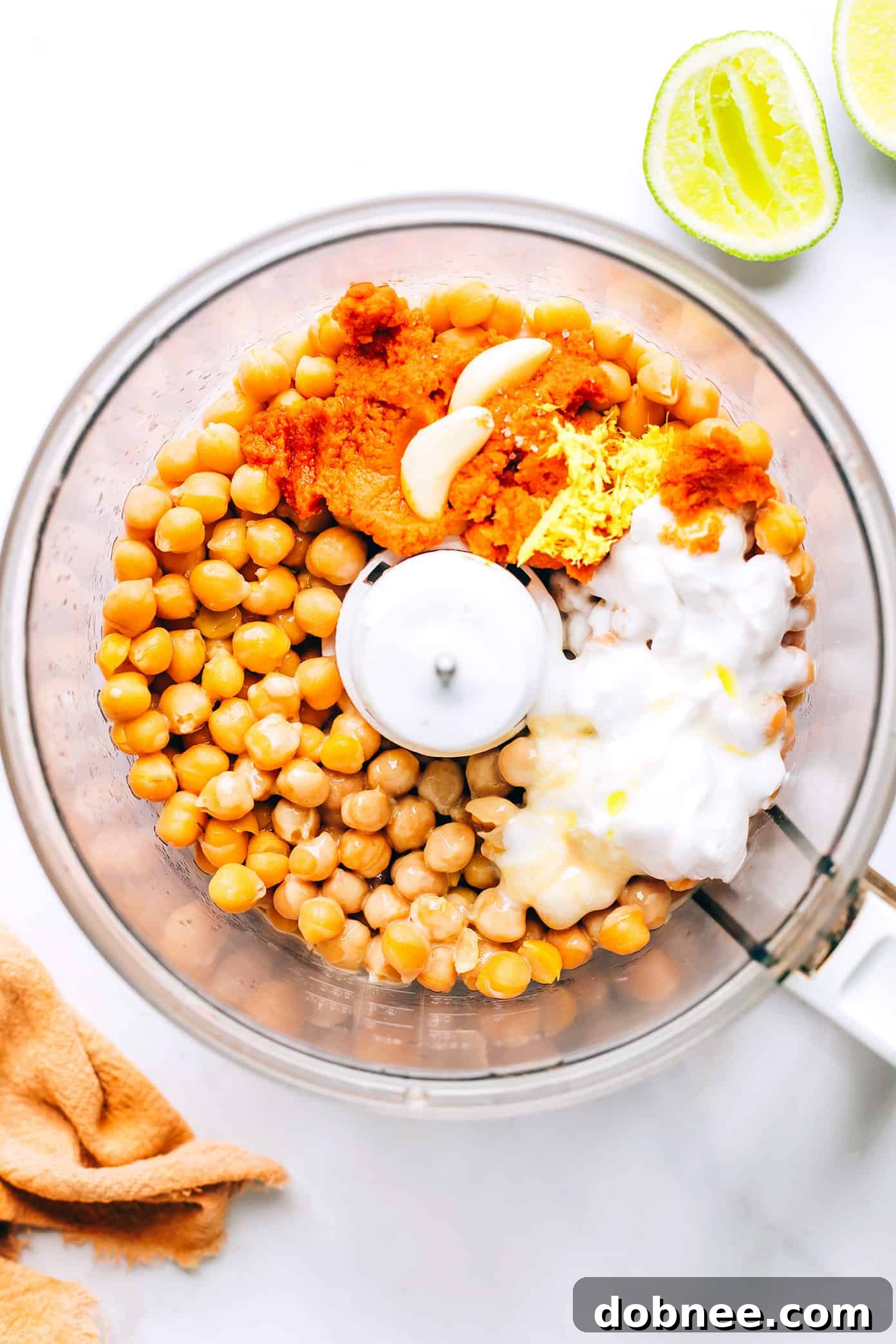 Red Curry Hummus being blended in a food processor