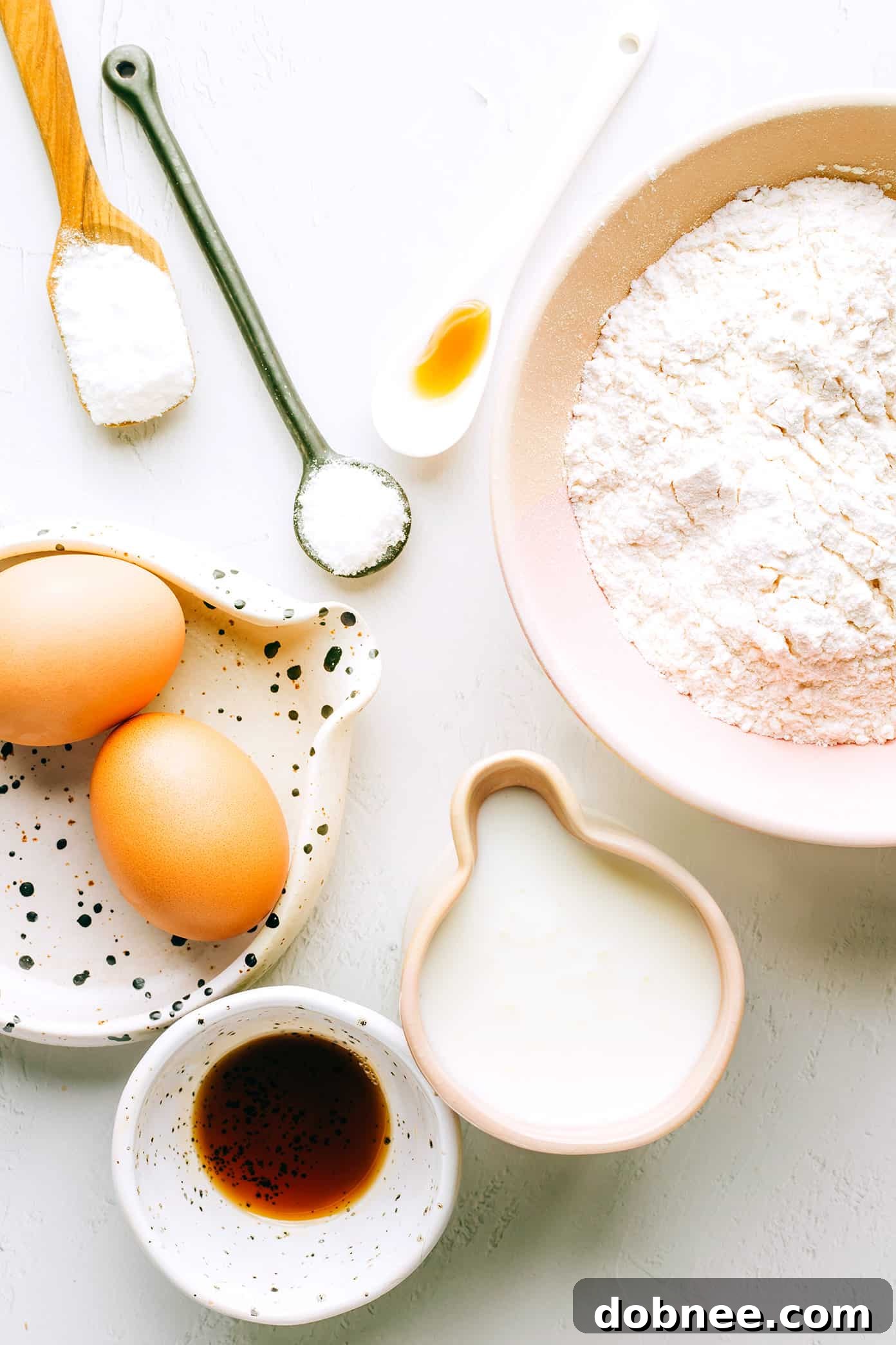 Freshly cooked kefir pancakes stacked on a plate with fresh berries and maple syrup
