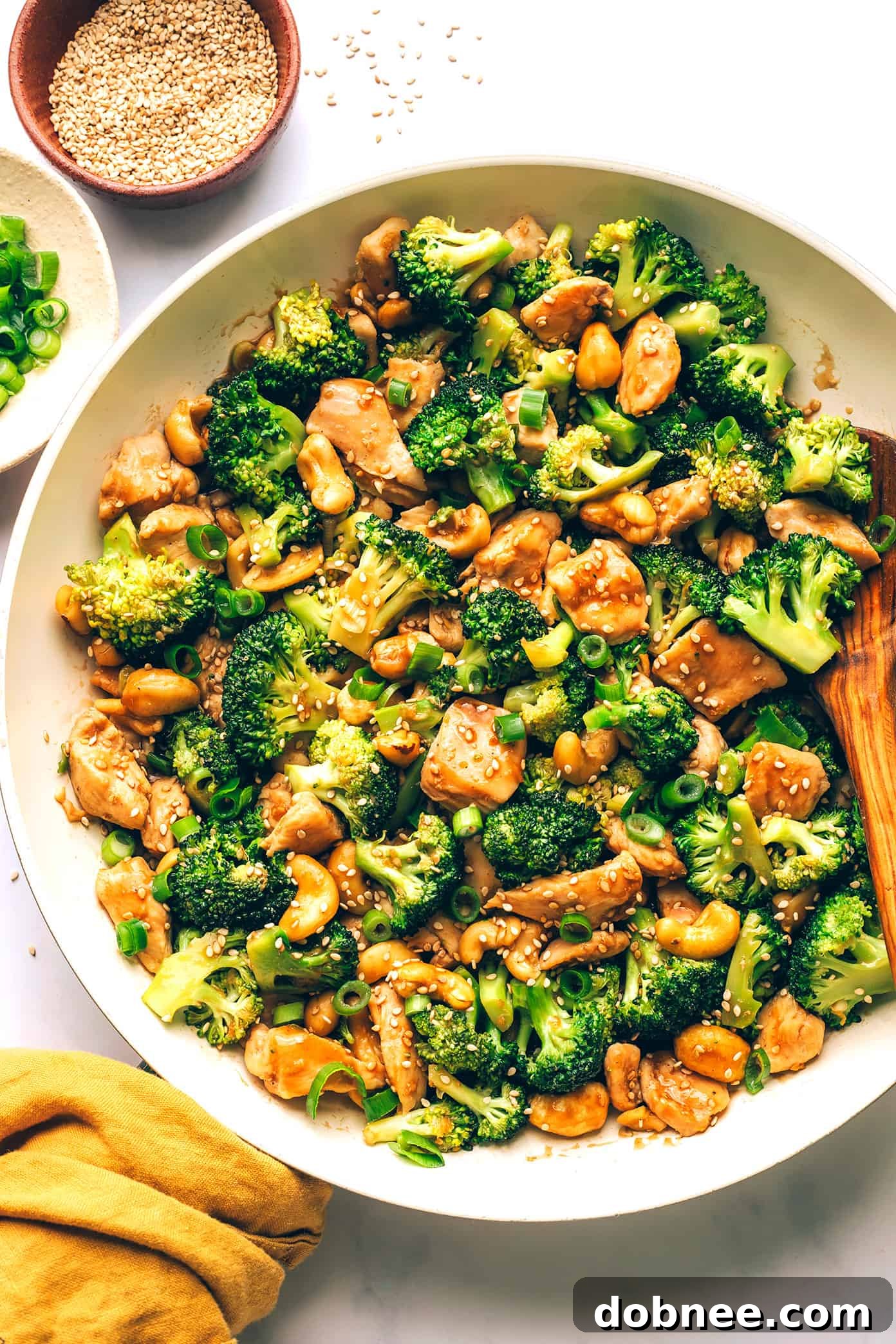 Ingredients for Cashew Chicken and Broccoli stir-fry laid out on a board