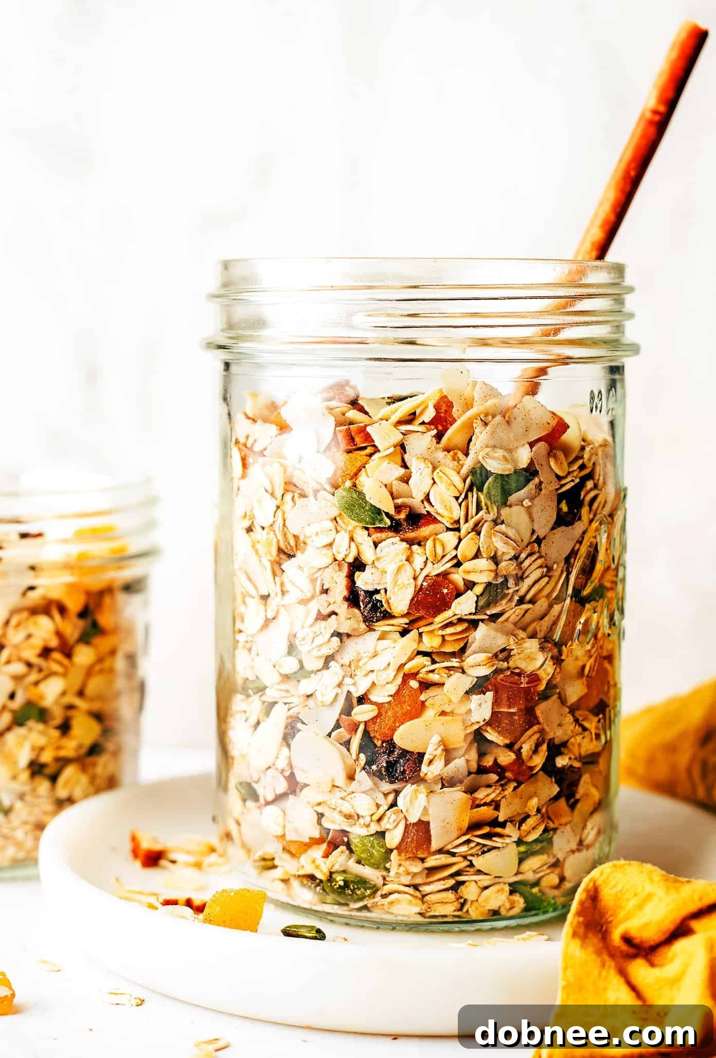 A glass jar filled with freshly made homemade muesli, ready for storage or gifting.