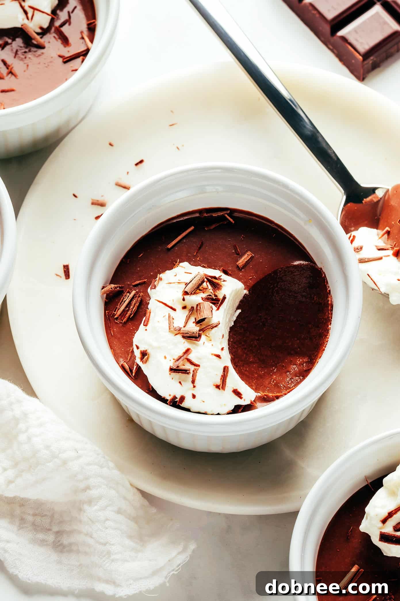 Effortless Silky Chocolate Pots 5 A single ramekin of chocolate pot de crème, perfectly set and ready to be garnished and enjoyed.