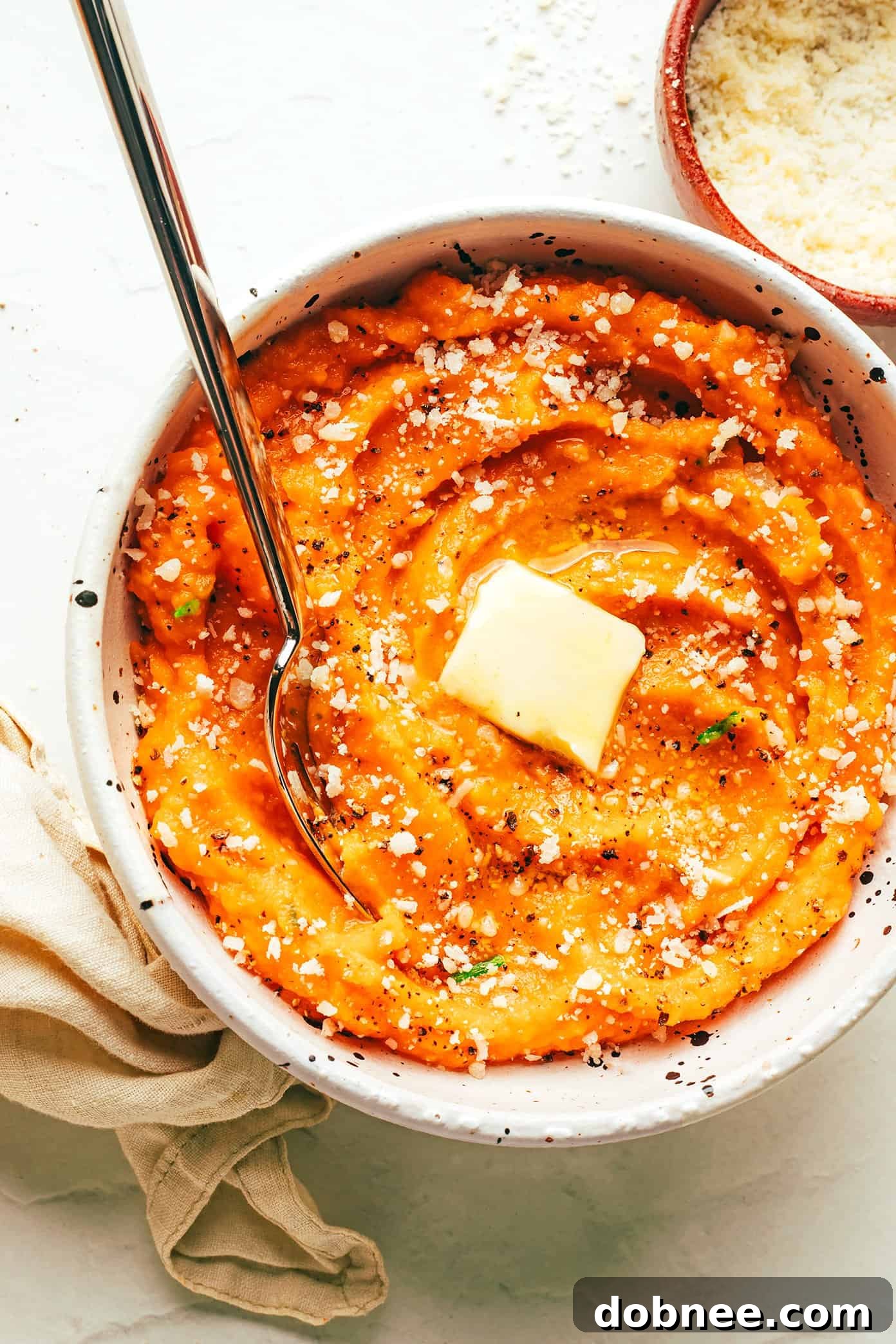 Garlic Parmesan Mashed Sweet Potatoes with Butter in Bowl