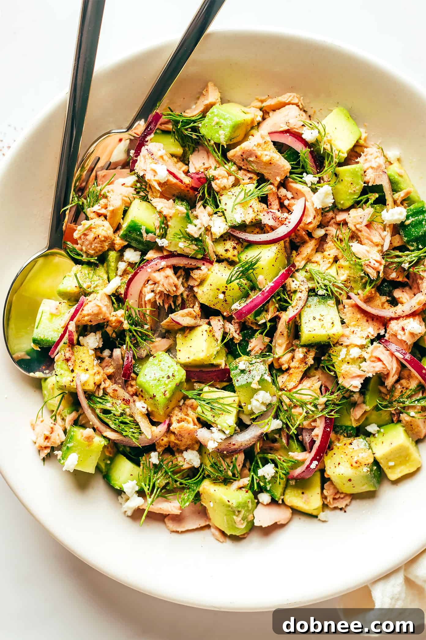 Tuna Avocado Salad with fresh dill in a bowl