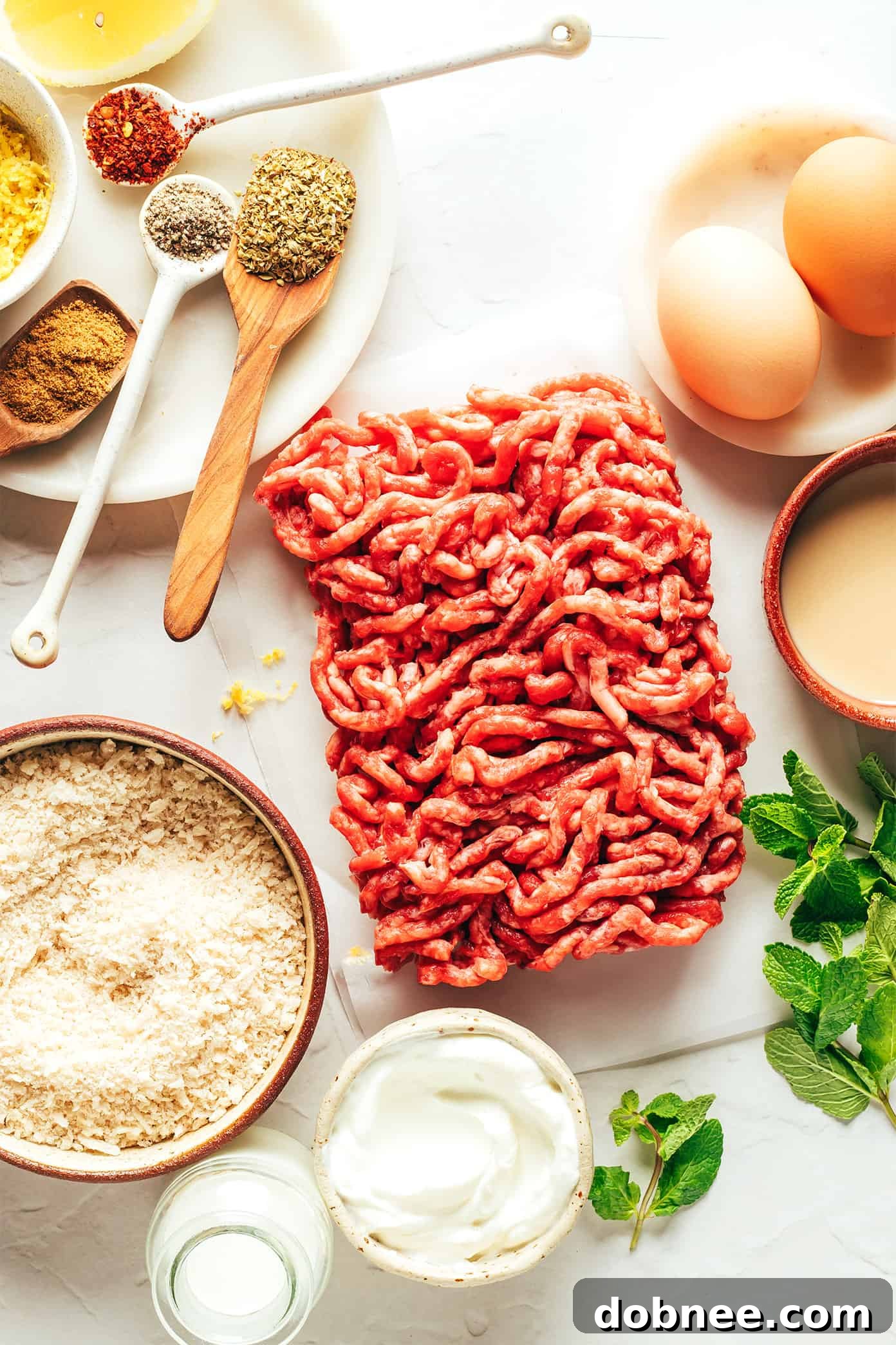 Close-up of baked Greek meatballs with fresh herbs