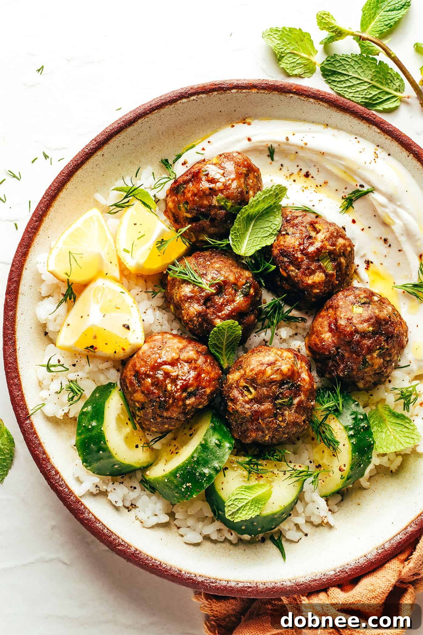 Greek meatballs served with fresh lemon wedges