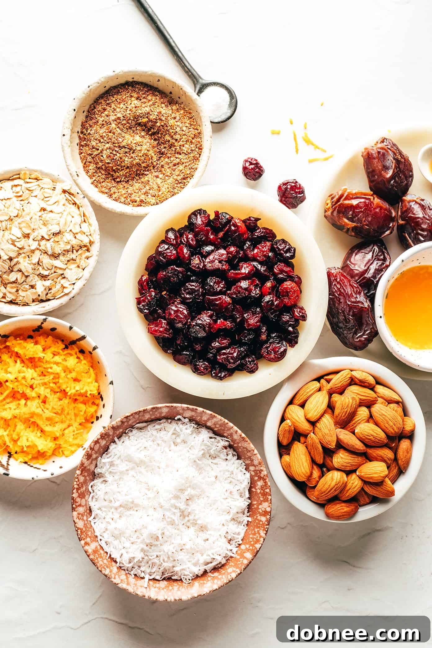 Close-up of a single Cranberry Orange Almond Energy Bite, showing its texture.