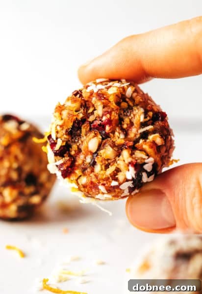 Cranberry Orange Almond Energy Bites on a serving board.