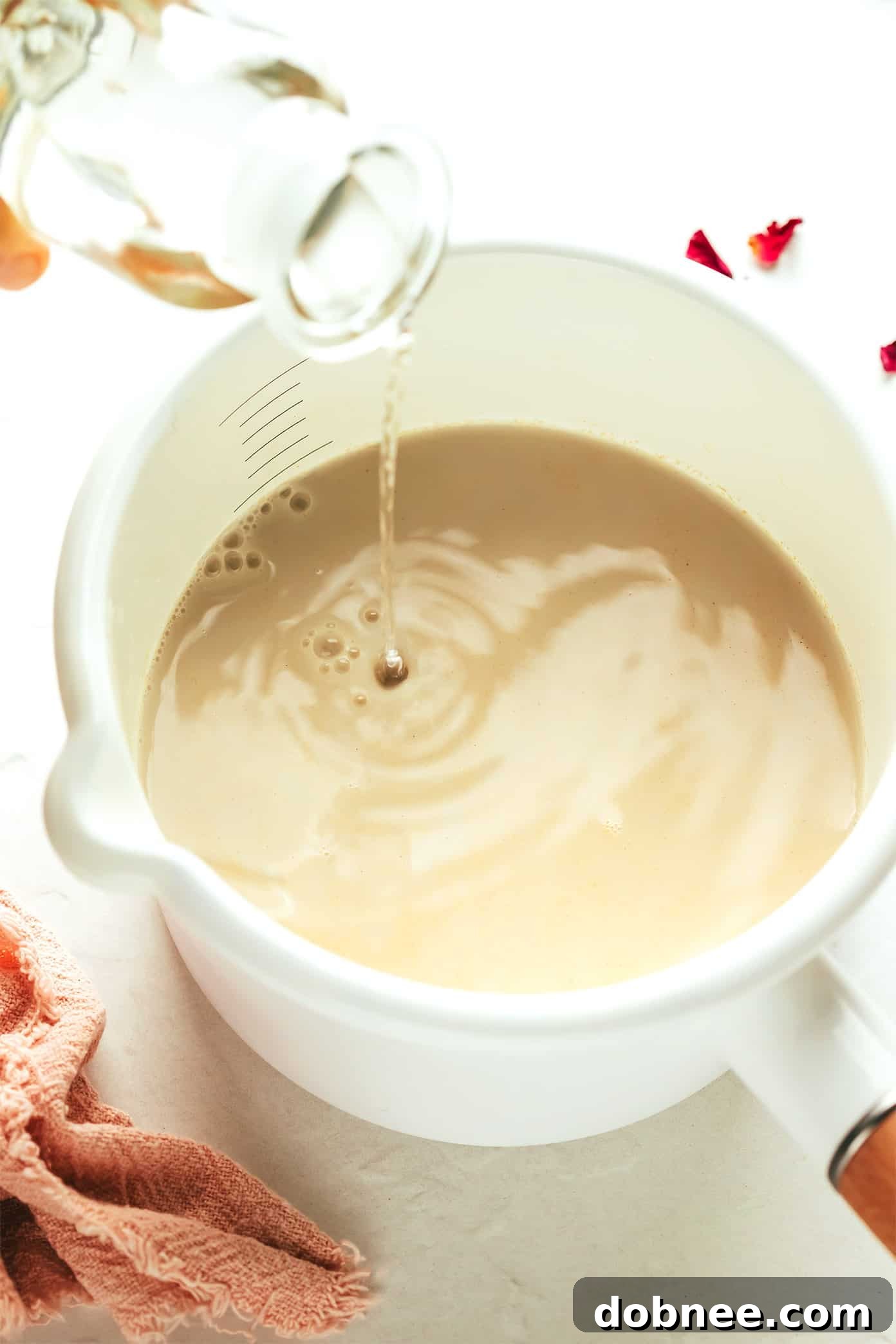 Velvet Rose Latte 4 Close-up of a steaming hot vanilla rose latte with a creamy froth, ready to be enjoyed.