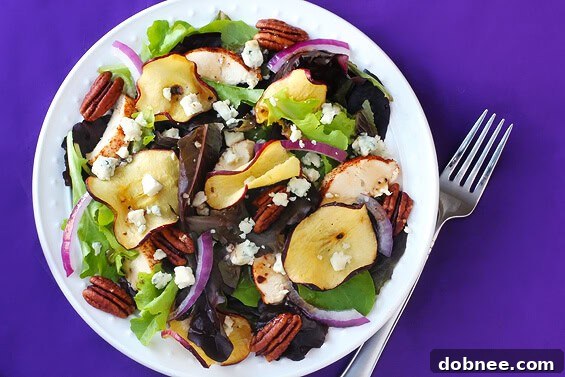 A refreshing bowl of favorite apple chicken salad with crisp apples, tender chicken, and fresh greens.